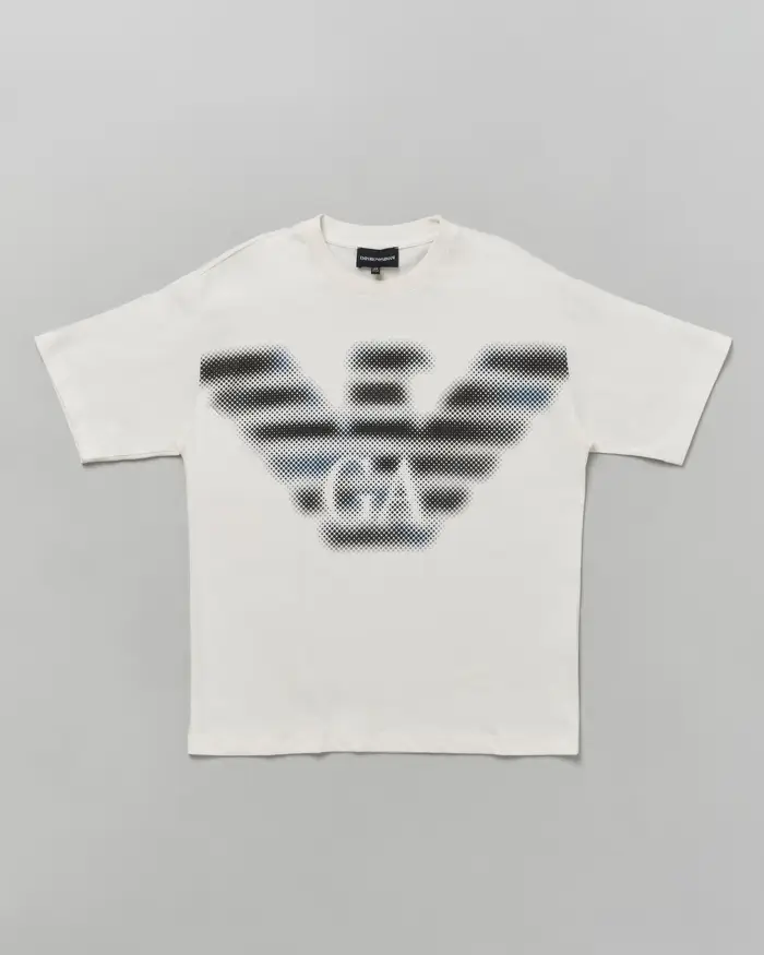 T-shirt Emporio Armani Junior bianca in cotone a maniche corte con stampa aquila logo sfuocata