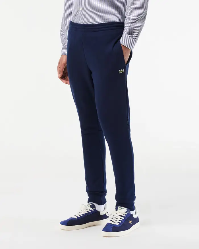 Pantaloni Lacoste blu in felpa di cotone con logo coccodrillo verde sul fianco