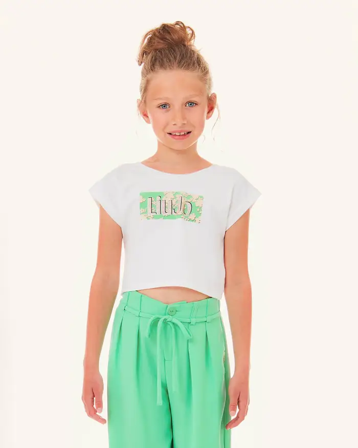 T-shirt bianca in cotone stretch a maniche corte scollata con stampa floreale e logo in strass 10-16 anni
